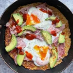 Crispy Potato Rosti with Eggs, Smoked Turkey, Avocado & Sriracha